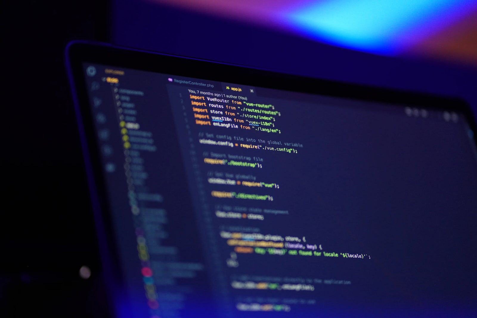 Laptop screen showing colourful programming code
