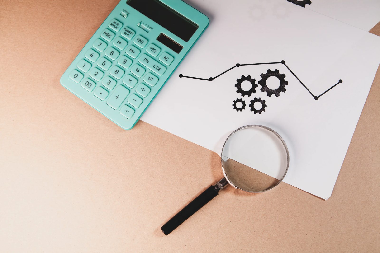 Magnifying glass, calculator and charts representing search and analysis