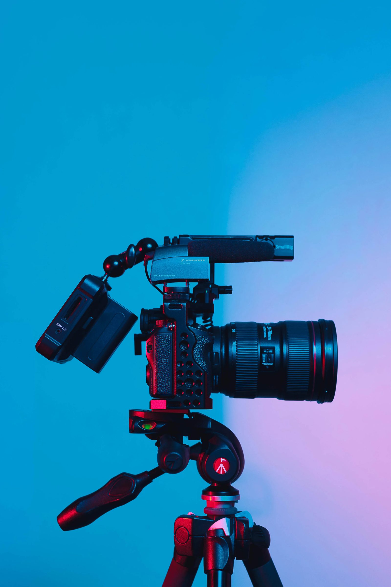 Professional video camera with a zoom lens on a tripod